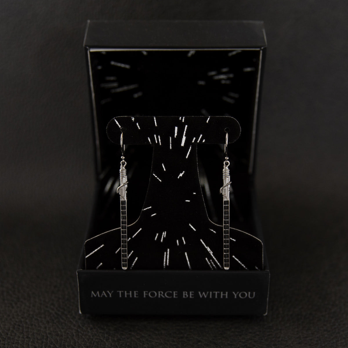 Back view of the earring blades demonstrating the polished black rhodium plating and secure mounting.