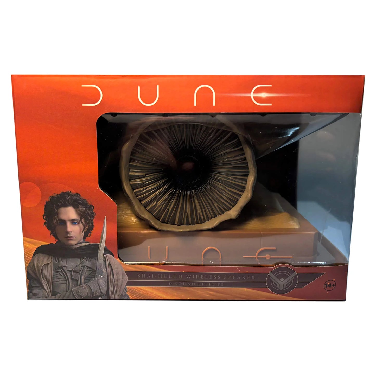 Lifestyle product shot displaying the Dune speaker styled on a modern desktop shelf setting