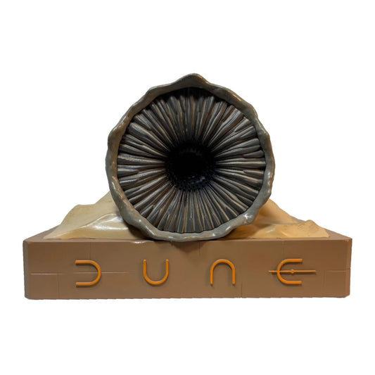 Textured limestone base supporting a detailed Shai-Hulud sandworm figurine with an integrated Bluetooth speaker-9