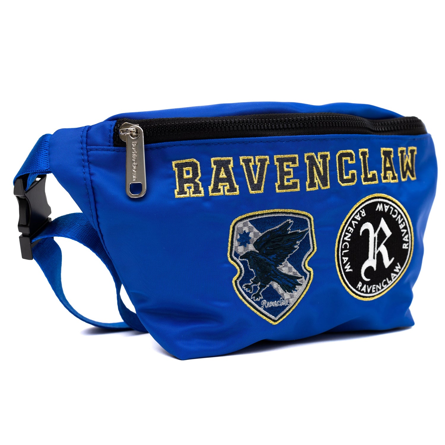 Close-up of the detailed Ravenclaw house patches embroidered on blue canvas fabric.