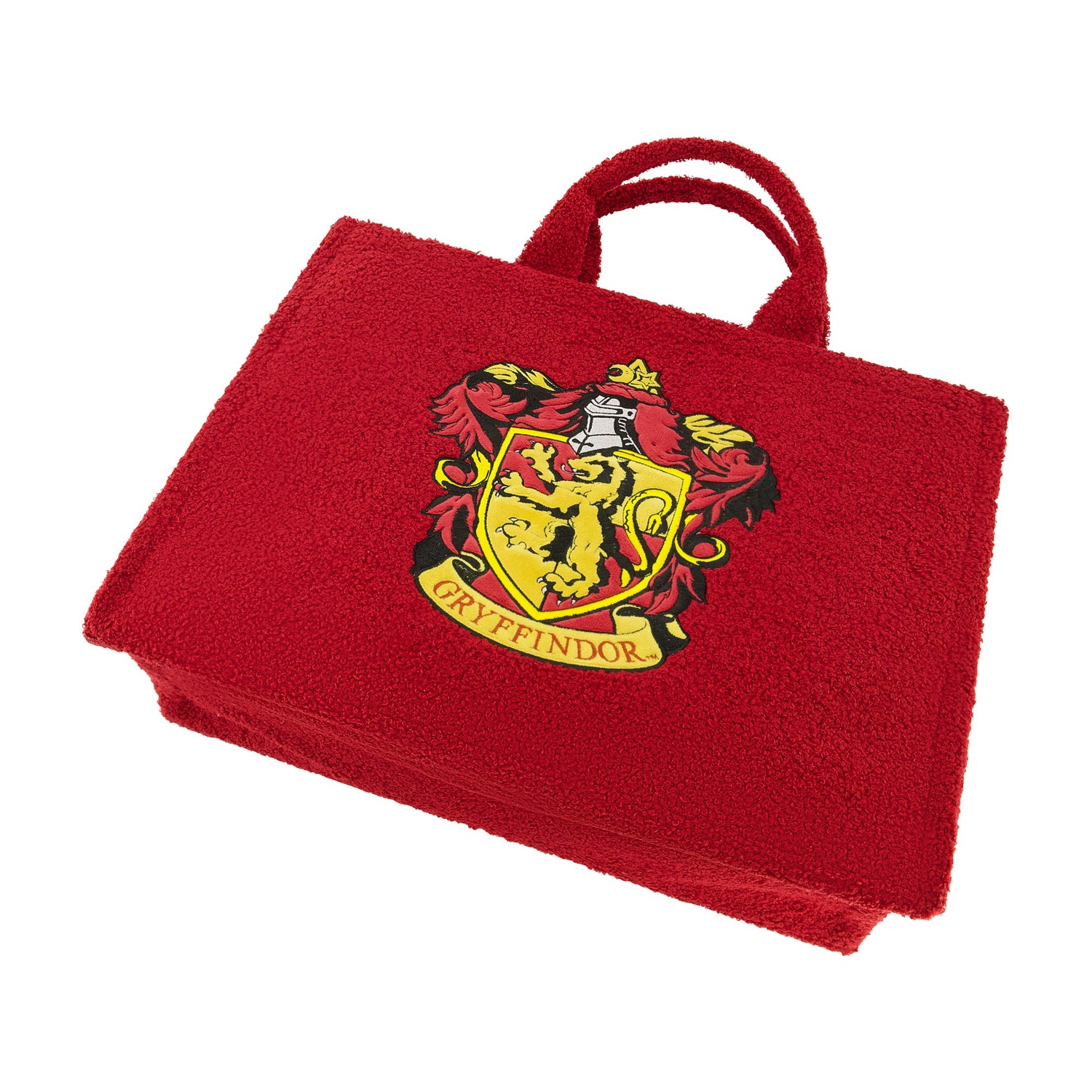 The adjustable and removable shoulder strap and top handles of the Harry Potter sherpa bag.