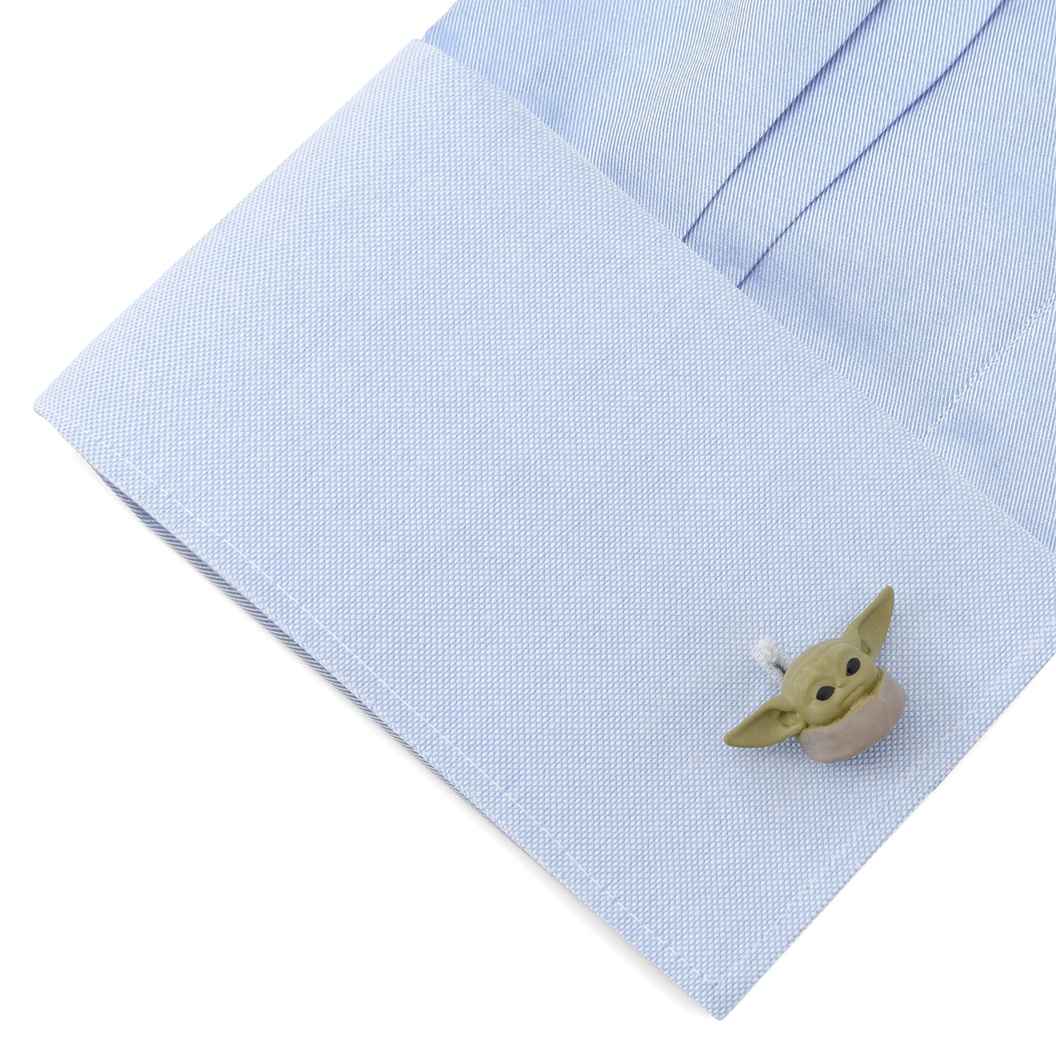 Reverse side of Grogu cufflinks featuring the debossed Star Wars logo and black enamel swivel backing.
