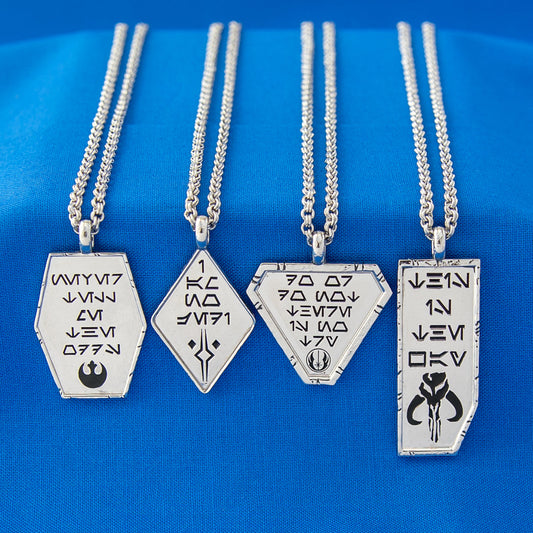 Close-up of Star Wars x RockLove This is the Way necklace showing Aurebesh engraving and Mythosaur symbol-7