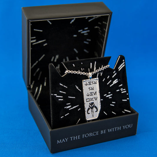 Close-up of Star Wars x RockLove This is the Way necklace showing Aurebesh engraving and Mythosaur symbol-6