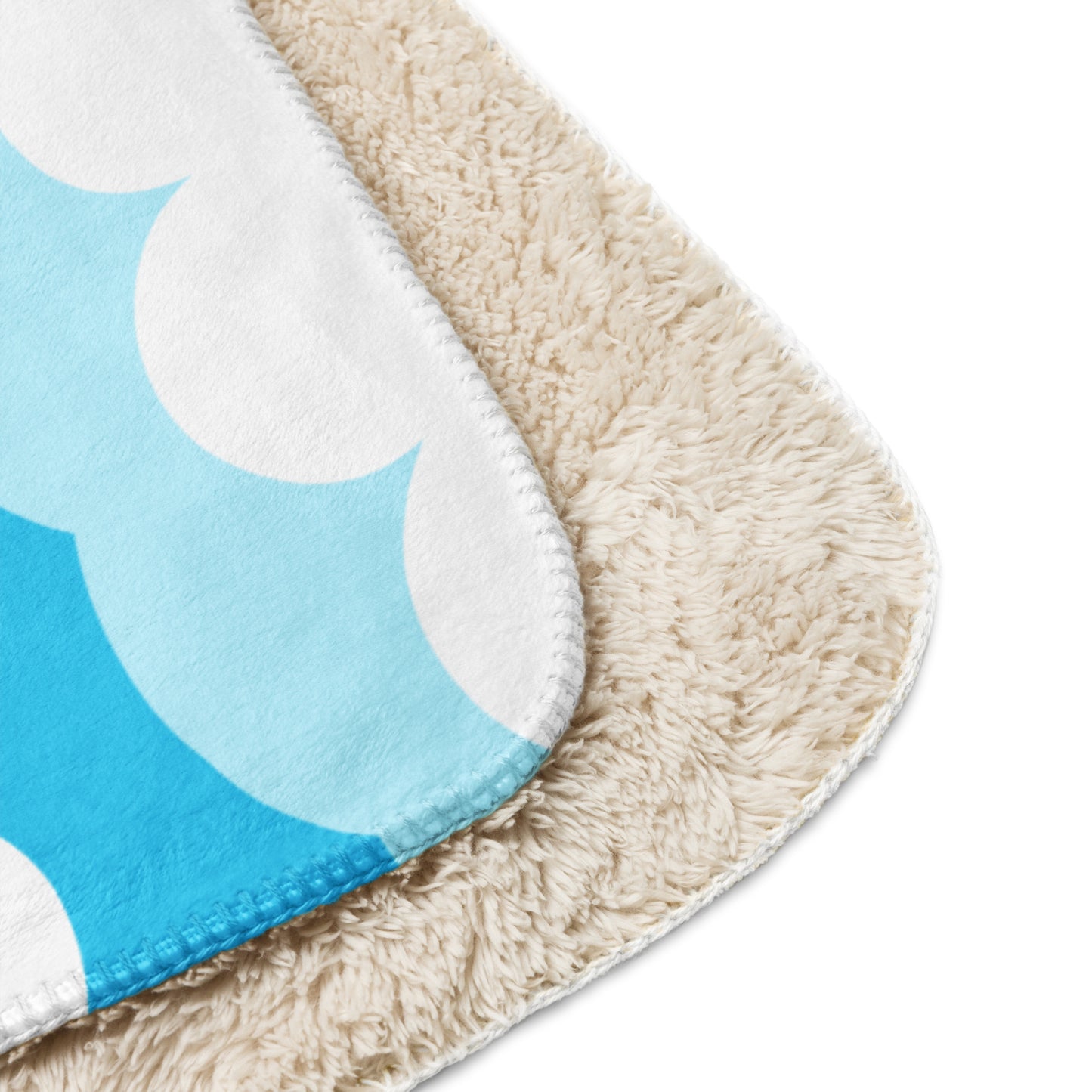 Buddy Logo Sherpa Blanket draped over a couch for home decor